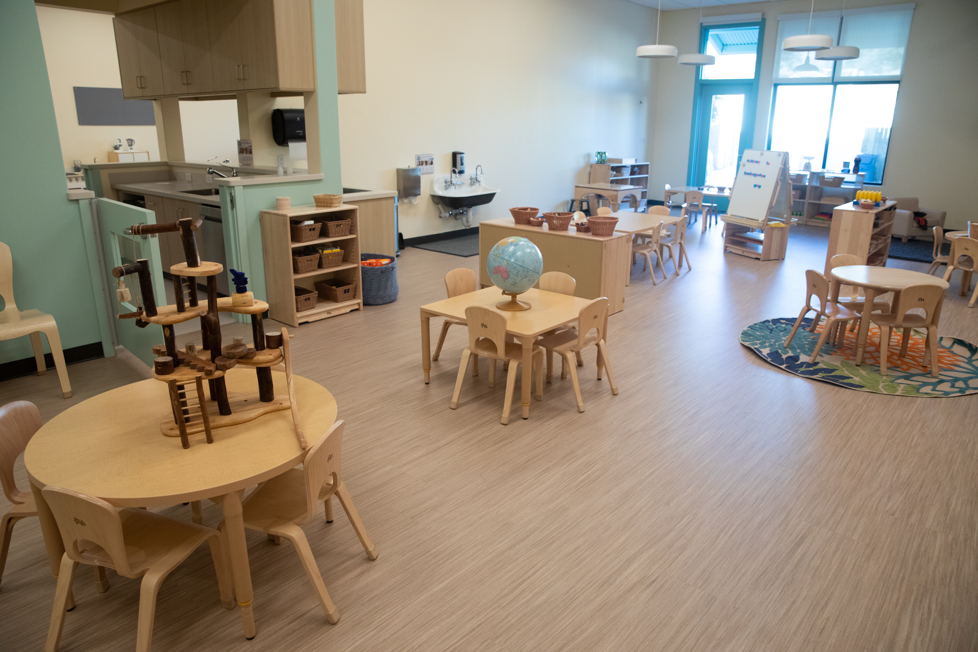 Inside the new Bright Path to Learning center, there are tables and chairs, learning toys and more for children.