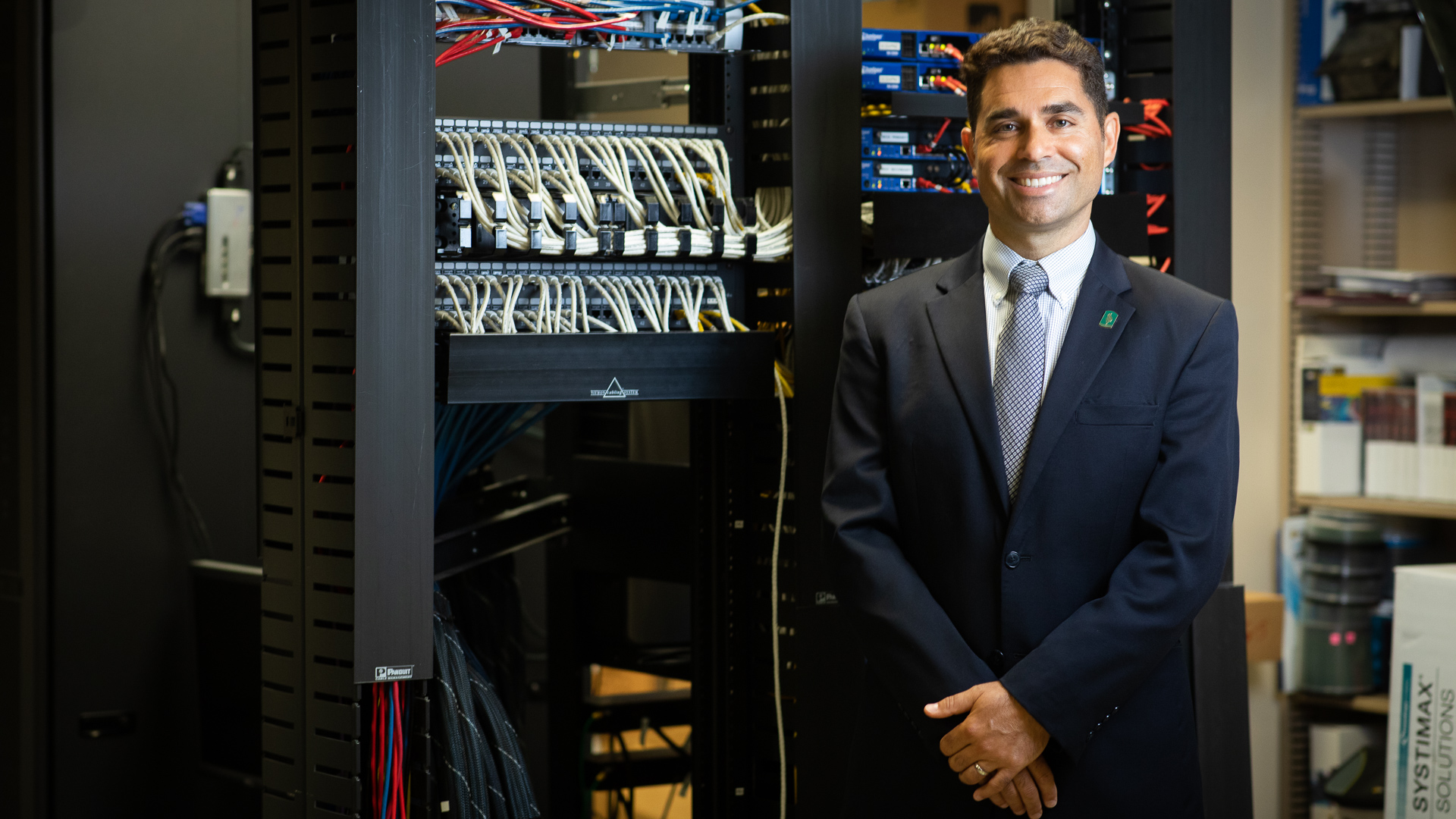 Kevan Shafizadeh, Sac State’s new dean of the College of Engineering and Computer Science, poses in a computer server room at Riverside Hall.