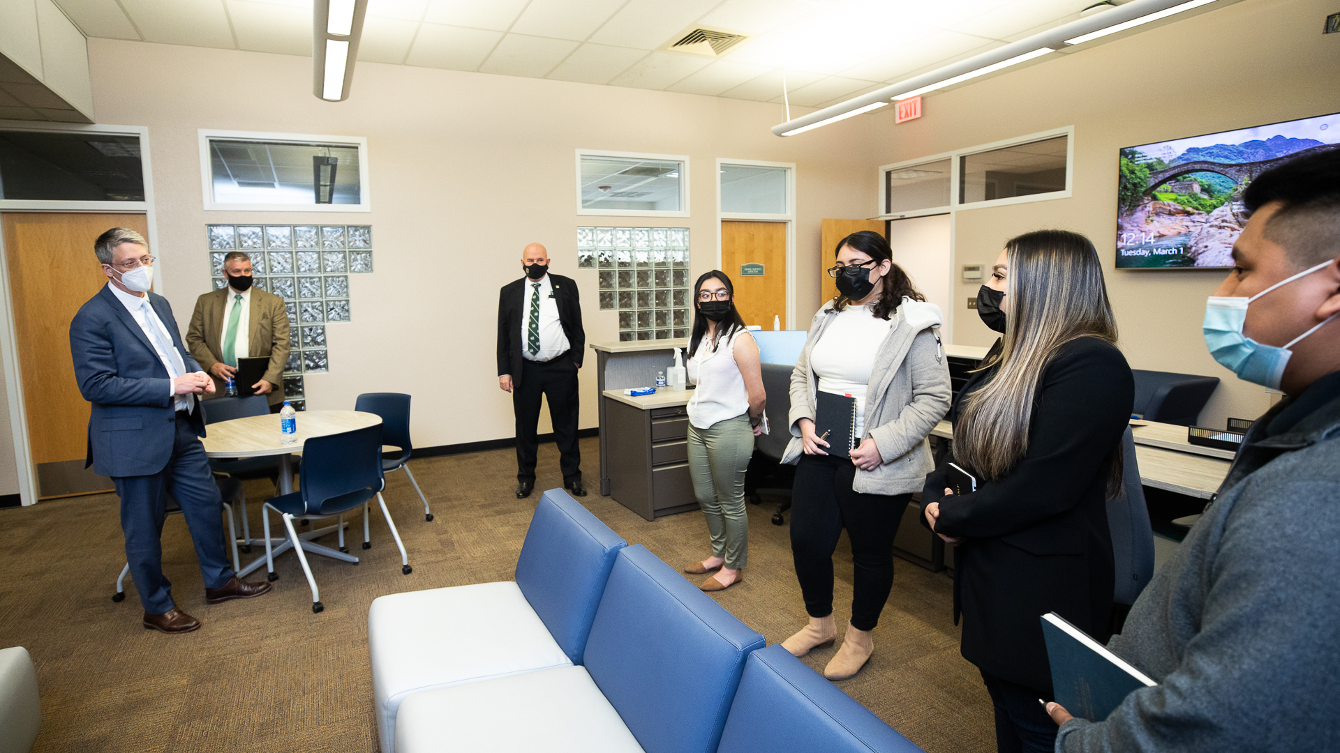 U.S. Education Undersecretary James Kvaal and Sac State President Robert S. Nelsen listen as students discuss their experiences at the University.