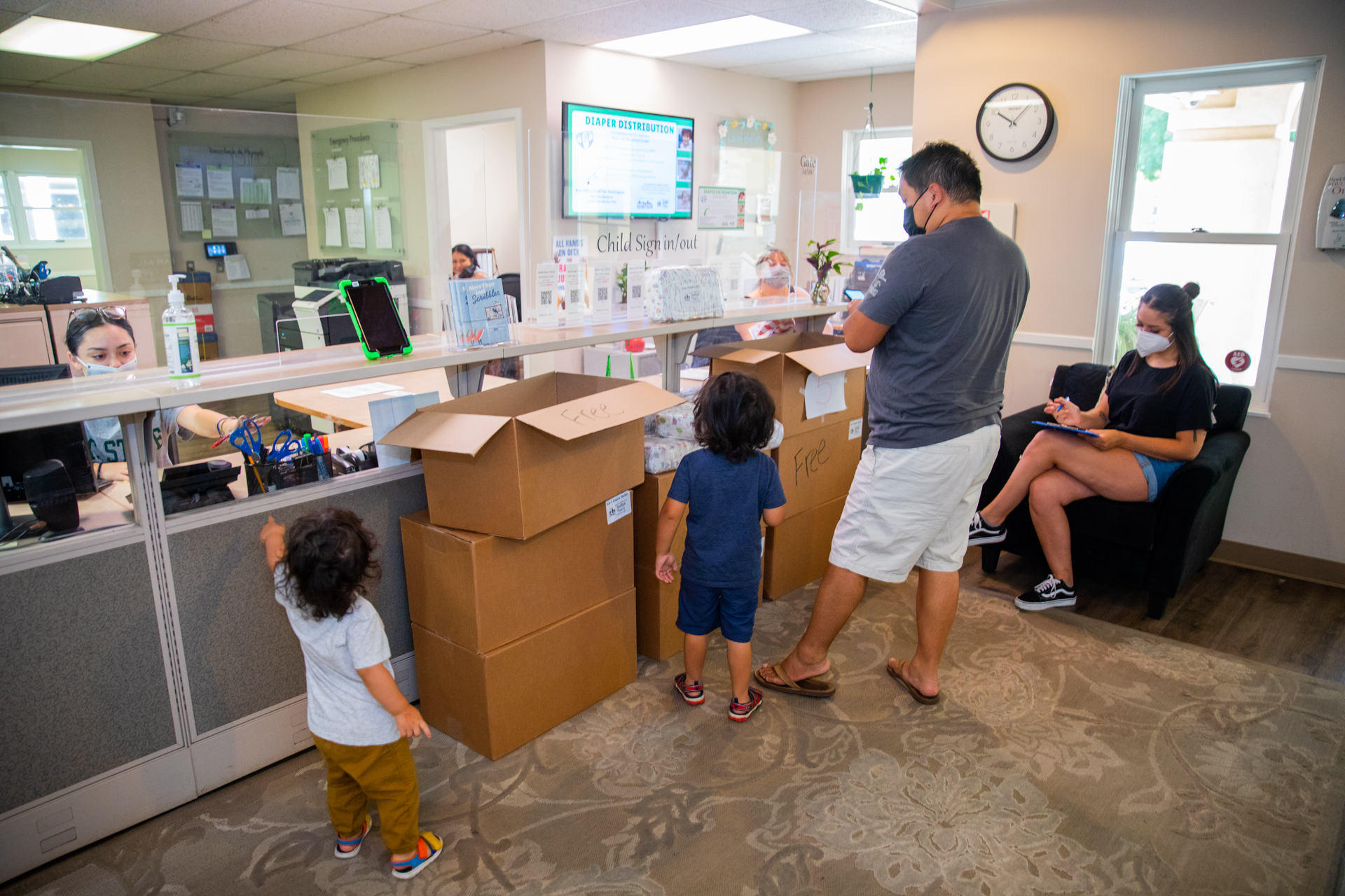 Parents and their children visit the Sacramento State ASI Children's Center, which partners with the Sacramento Food Bank to distribute free diapers.