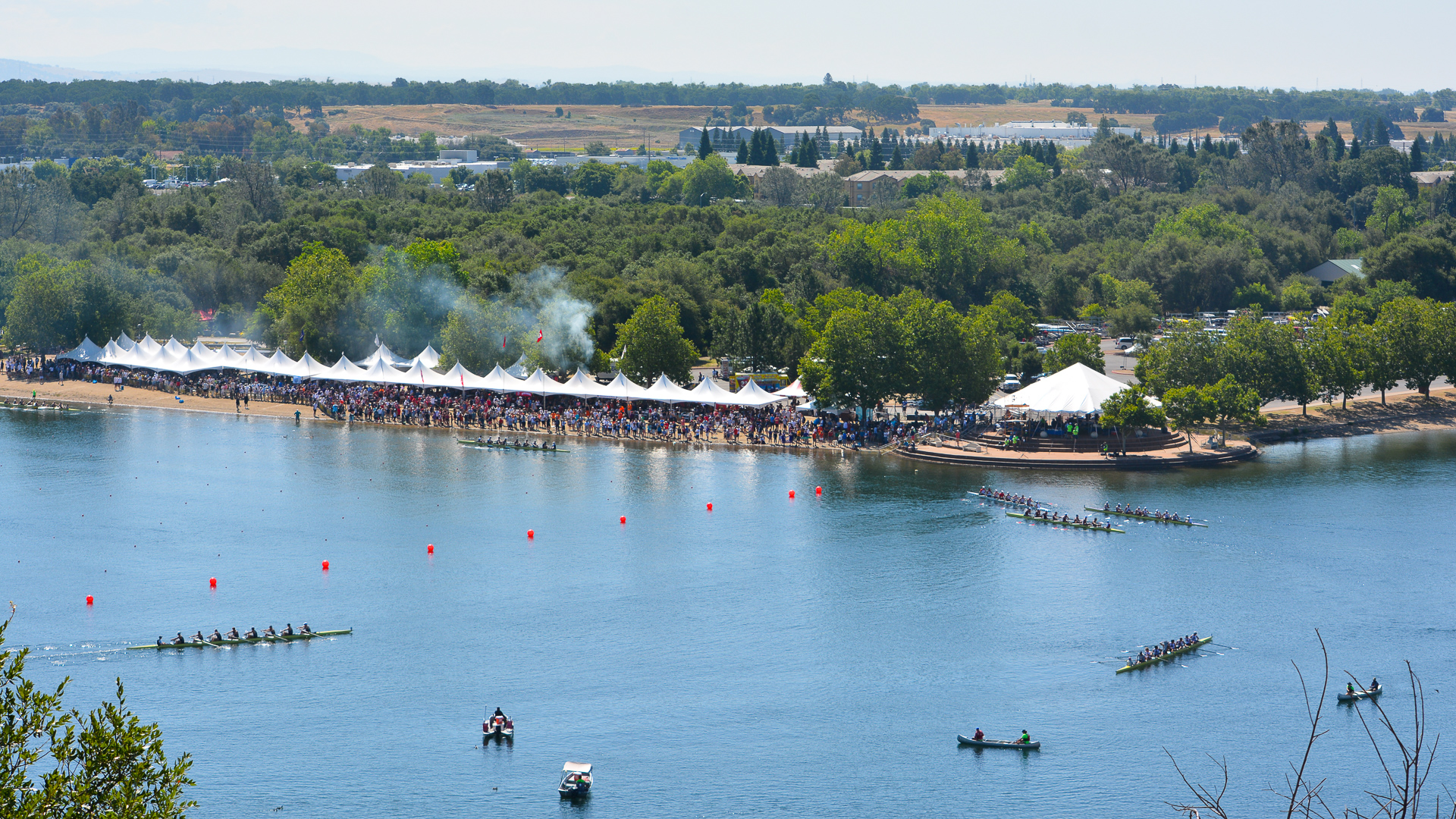 An overhead view of a regatta rowing event at Sacramento State's Aquatic Center on Lake Natoma.