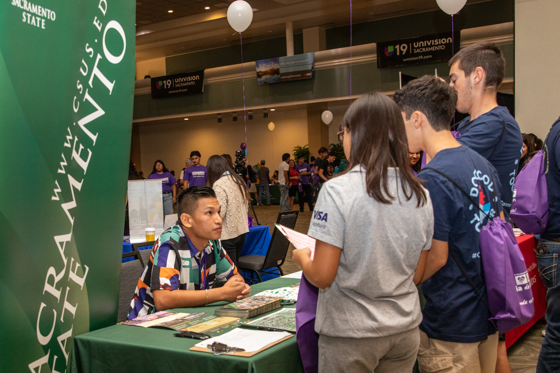 Students learn about campus resources at Feria de Educacion.