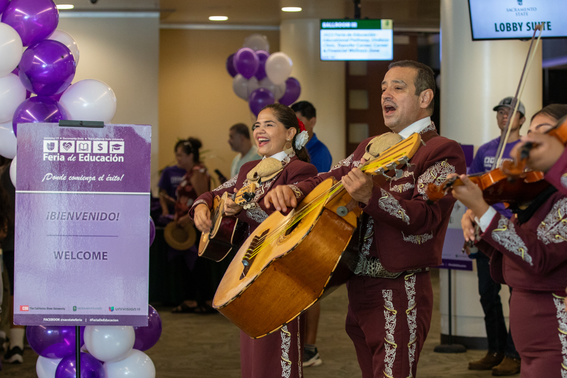 Feria de Educacion event attendees enjoy mariachi music.