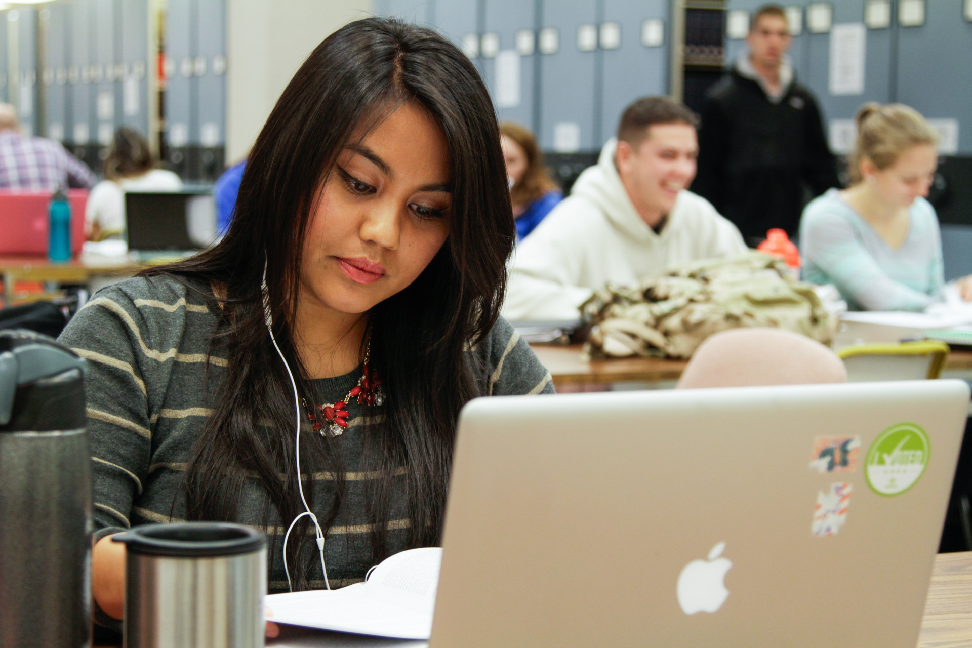 A student works on a laptop in the University Library.