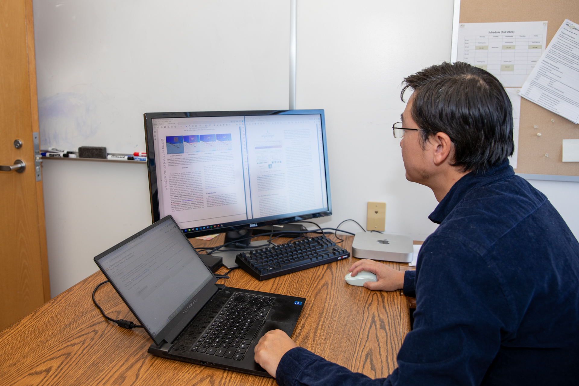 Victor Chen, sitting at a desk using a computer