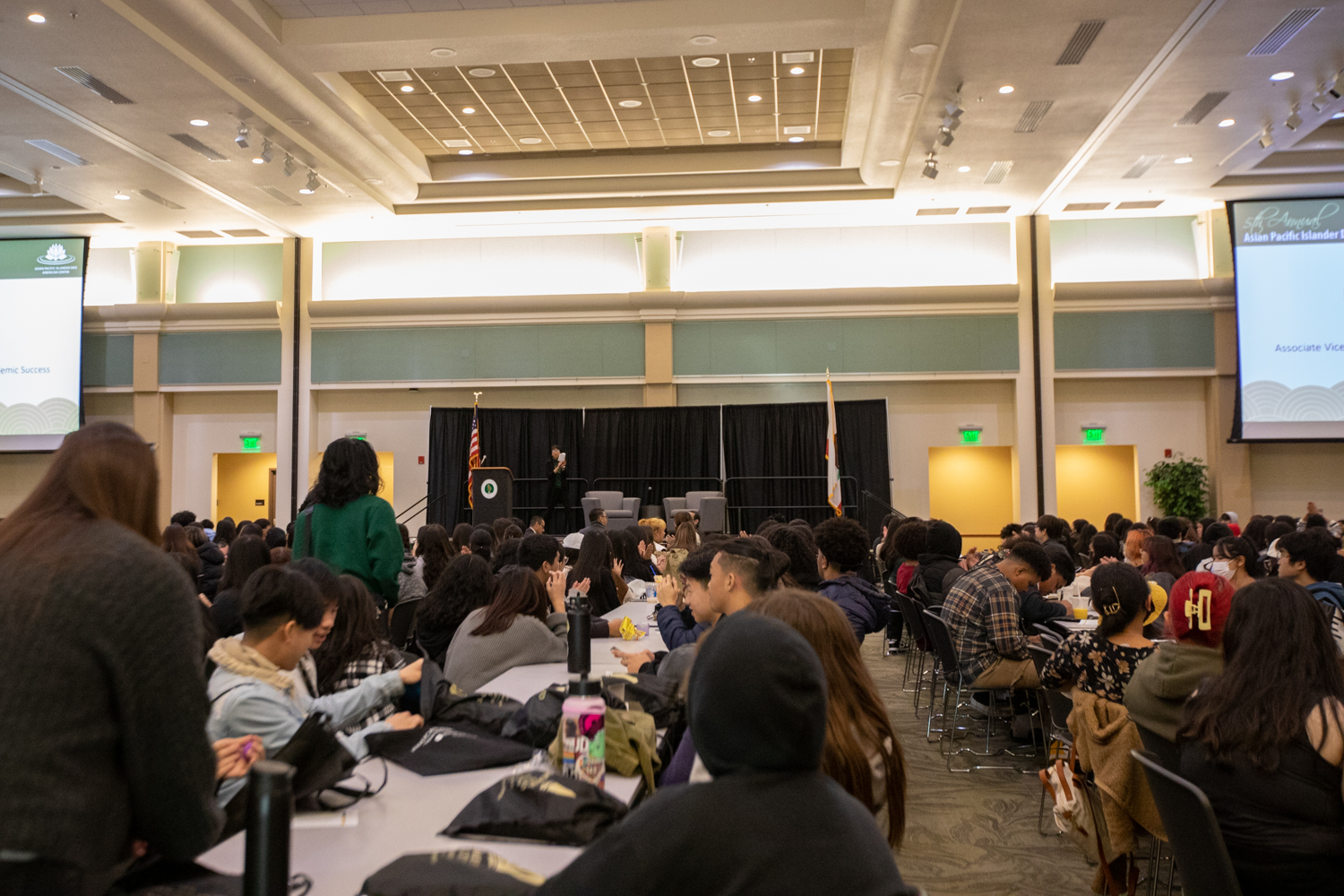 Students at tables in the University Ballroom at Sac State during APIDA College Day.