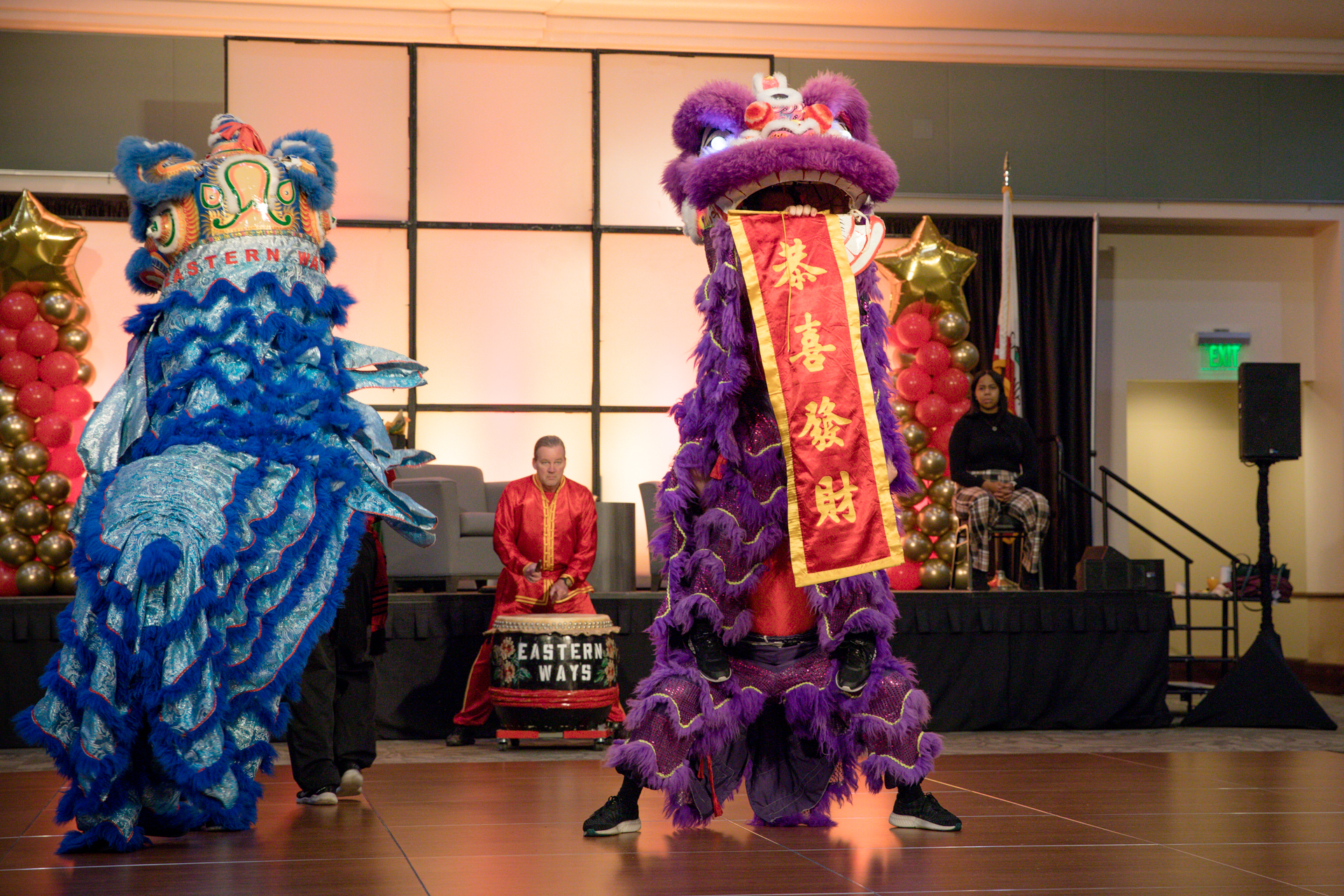 Performers dressed in dragon costumes dance at the APIDA Center grand opening.