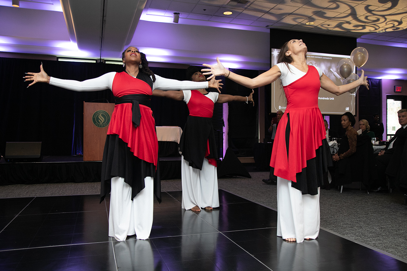 Performers in red and white attire entertained crowds during the MLK Center's grand reopening.