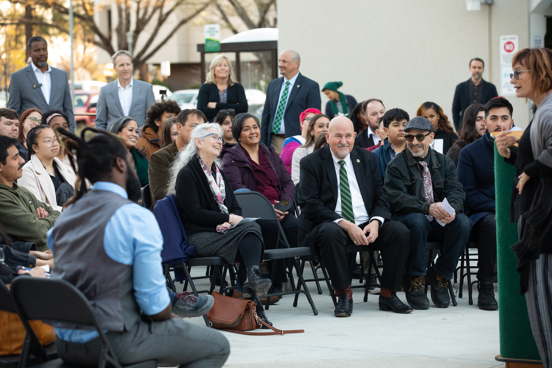 Campus leaders and others in attendance at the unveiling of Tributary, a public art display.