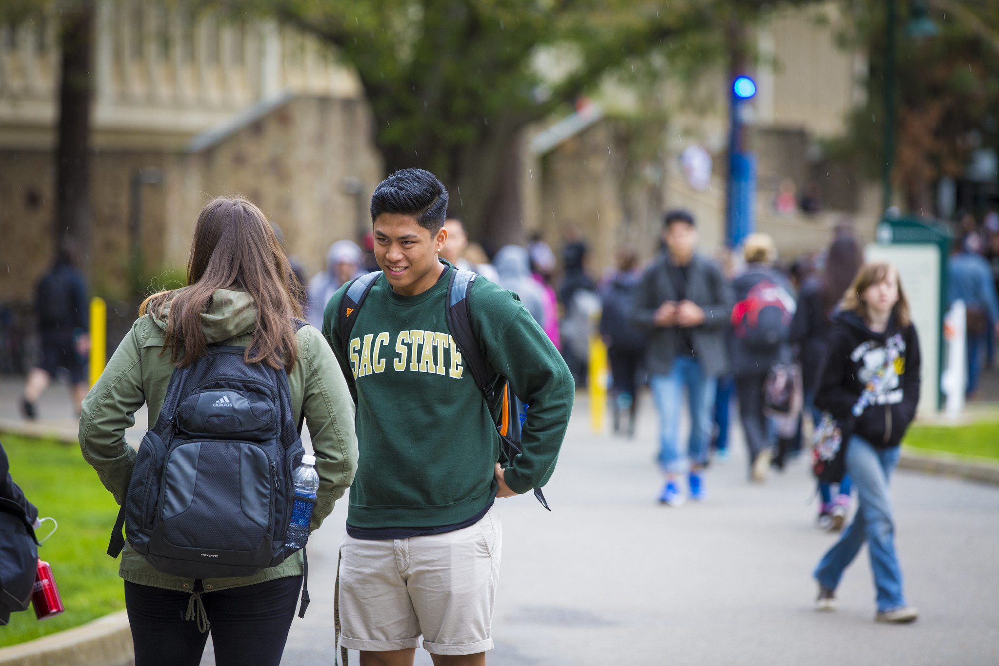 Students walk on campus on a spring day. 