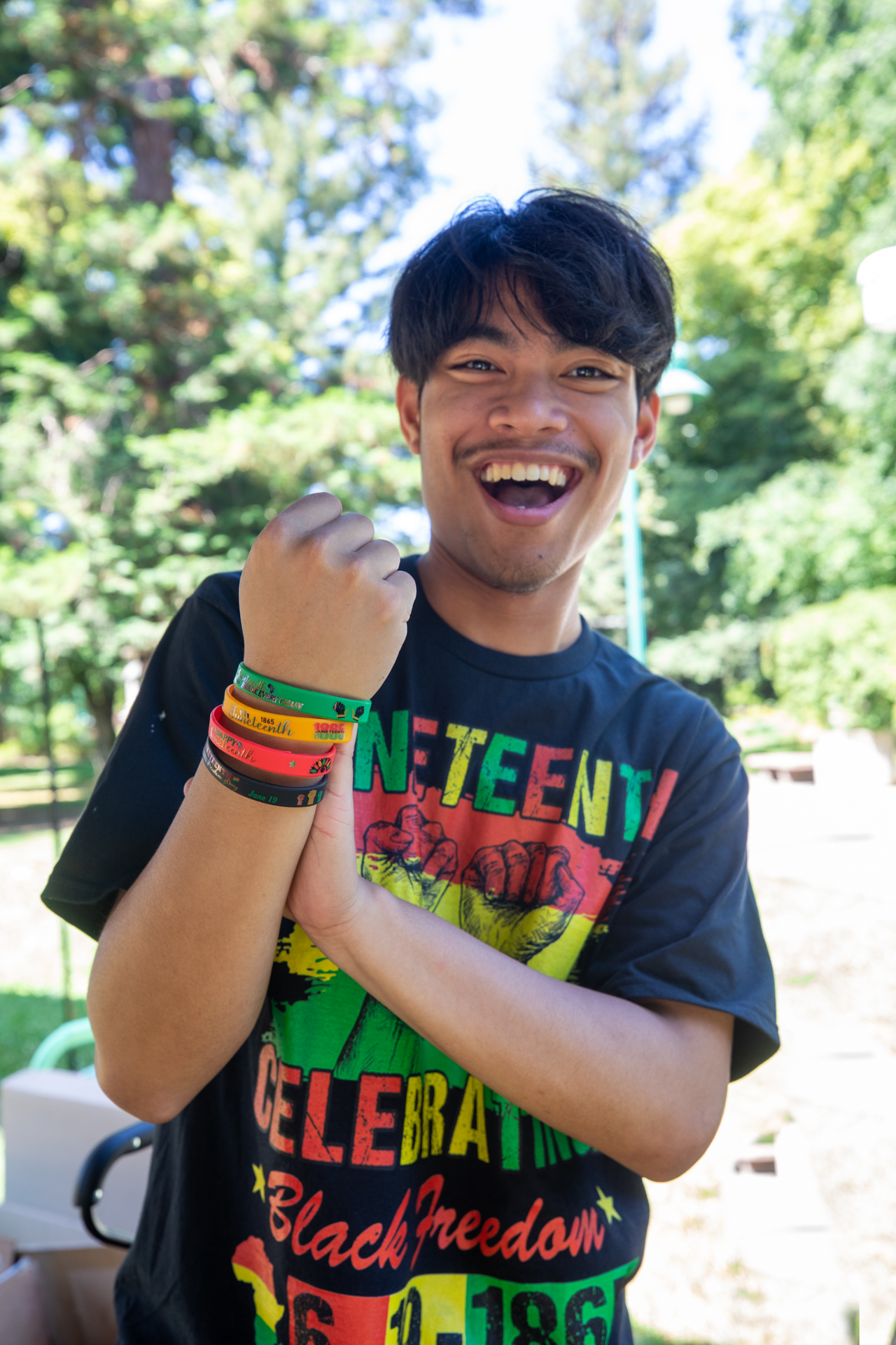 A member of the campus community shows off African-inspired bracelets.
