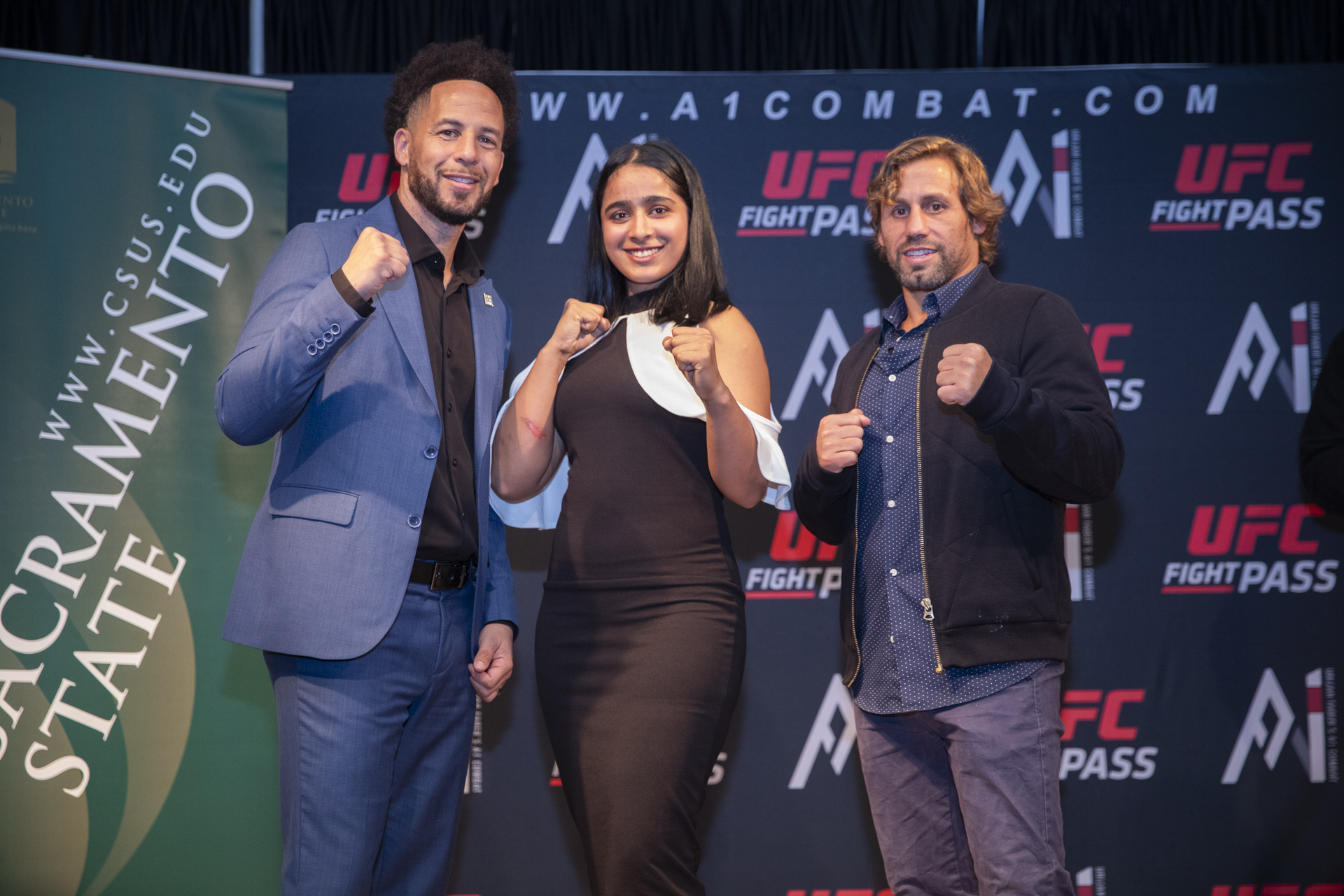 President Wood, Aranjot Kaur and Urijah Faber pose during the Combat U press conference.