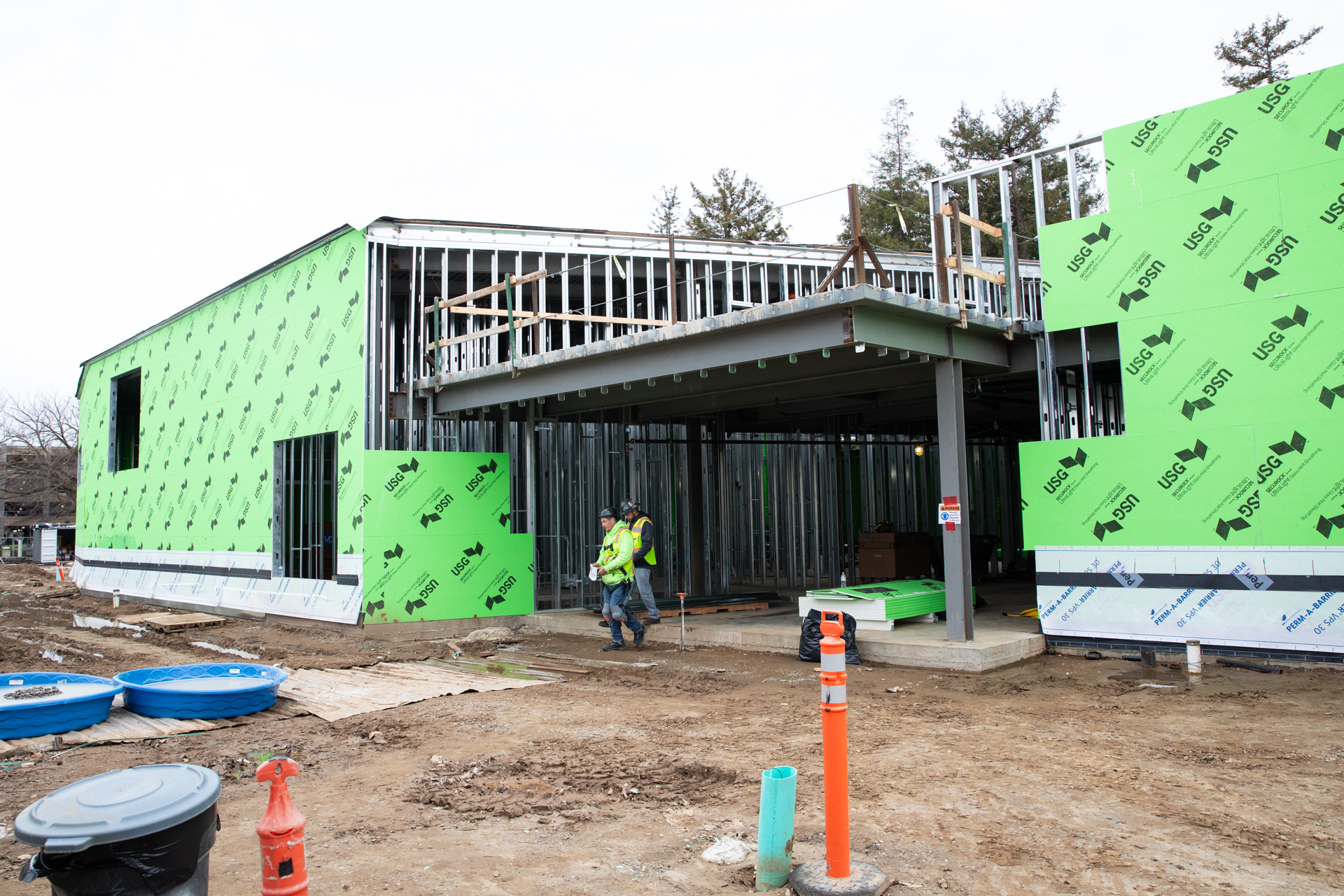 Construction is progressing at the new art building with steel beams and temporary walls up.