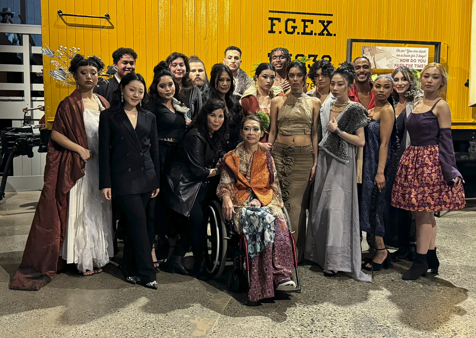 A group of students modeling various clothing items created for Fashion Week Sacramento. 