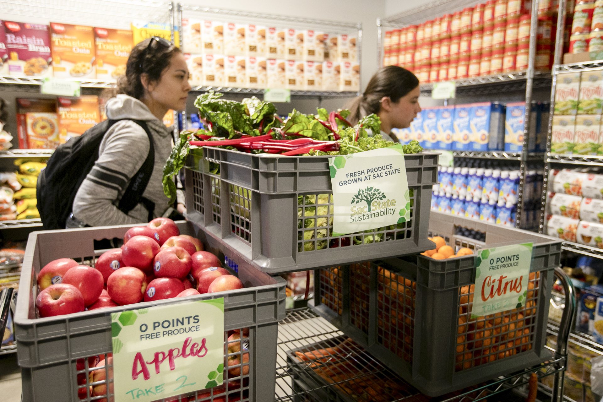 Students visit the food pantry to pick out locally grown produce and other items.