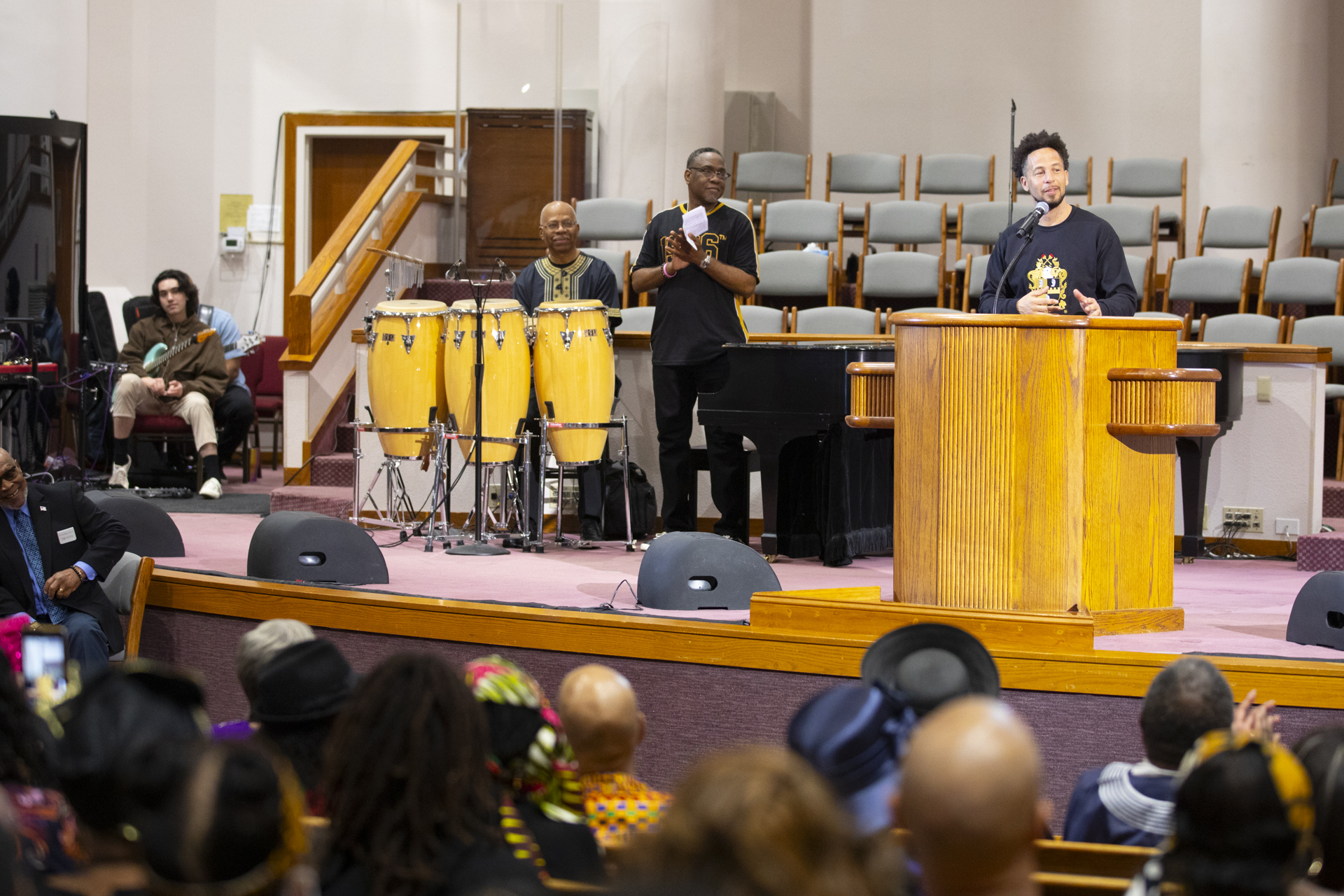 President Luke Wood speaks on stage during Super Sunday at a local church.