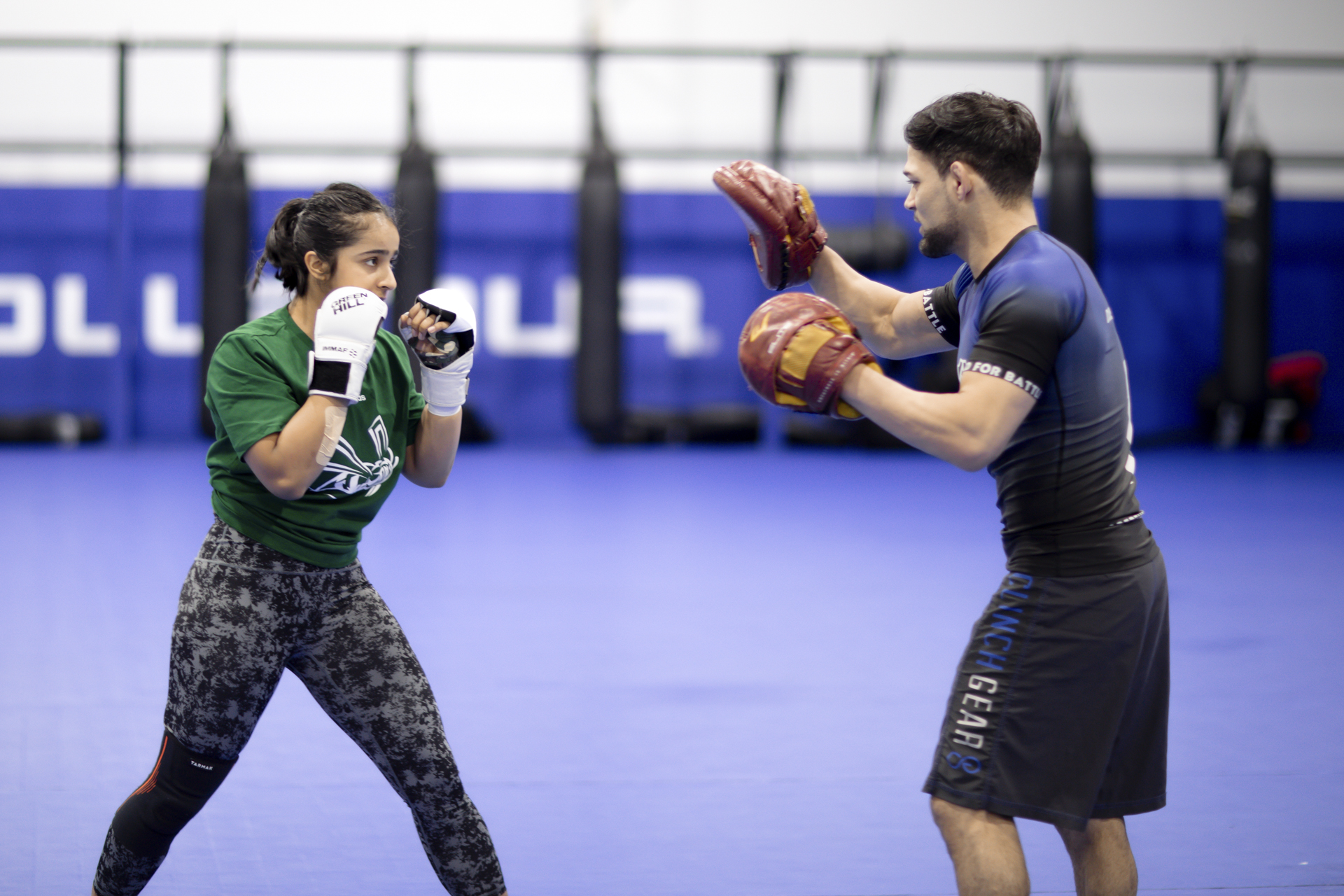 A Combat U participant trains with a sparring partner. 