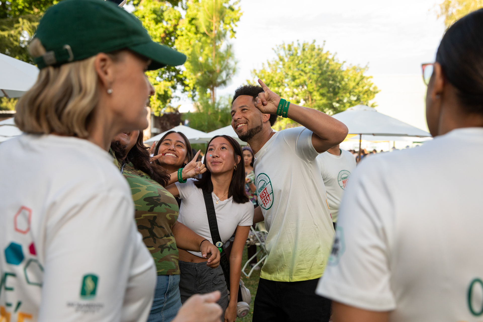 President Luke Wood poses for a selfie with students at Hornet Nest Fest.