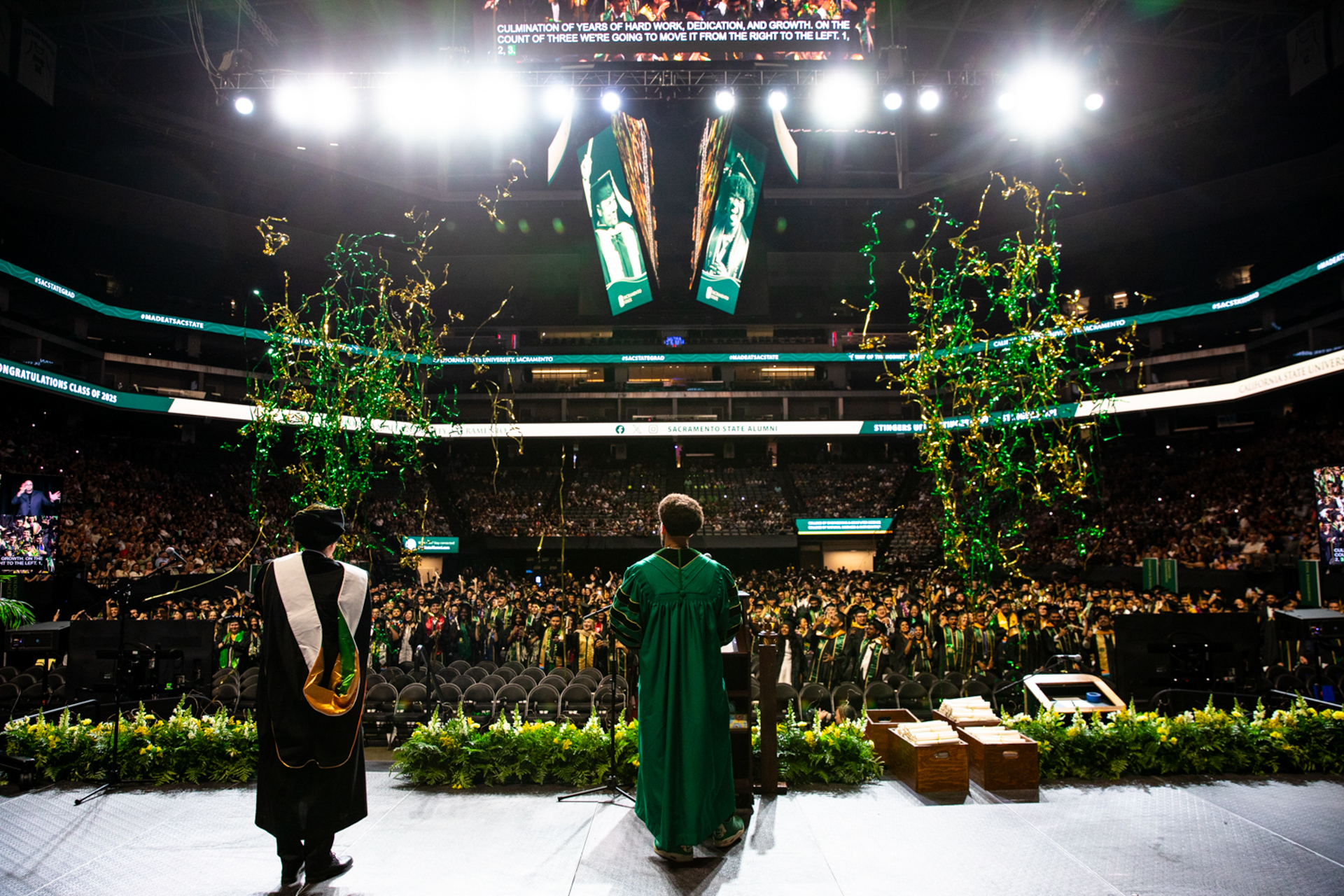 Cannons shoot confetti over the crowd of graduates during the ECS and NSM combined ceremony.