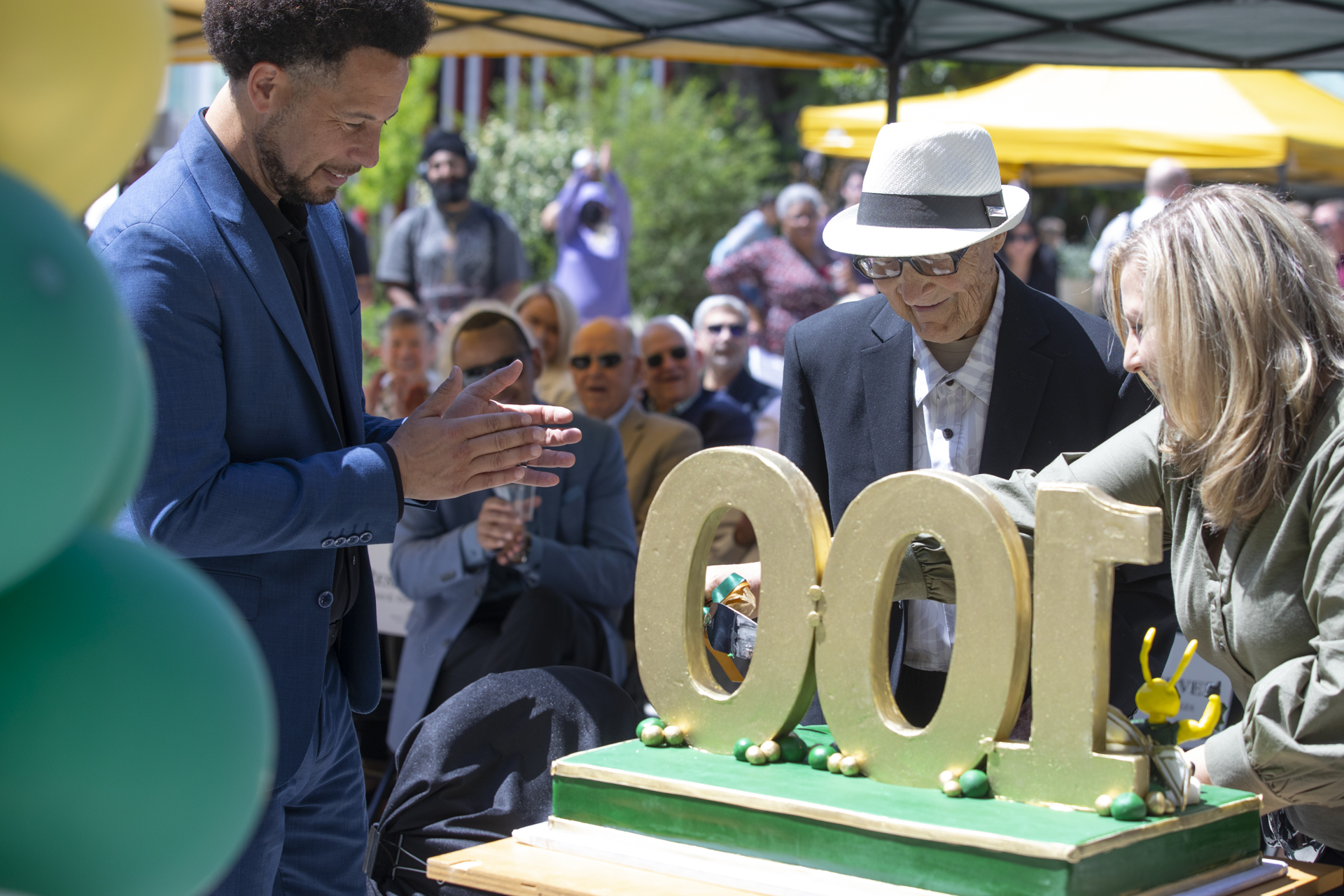 Ernest Tschannen getting a piece of cake during his 100th birthday celebration.