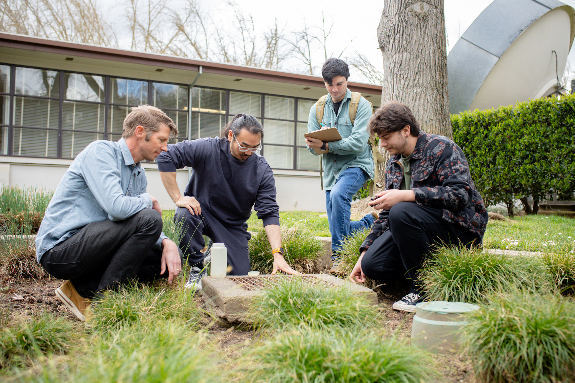 Julian Fulton and students monitoring environmental factors on Sac State's campus.
