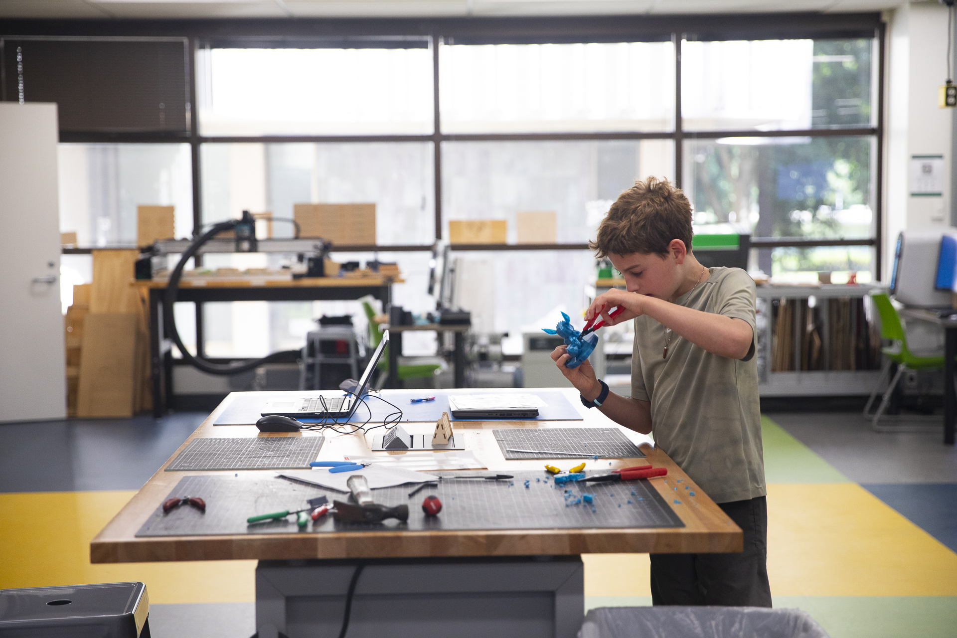 A young student working inside the StingerStudio Makerspace.