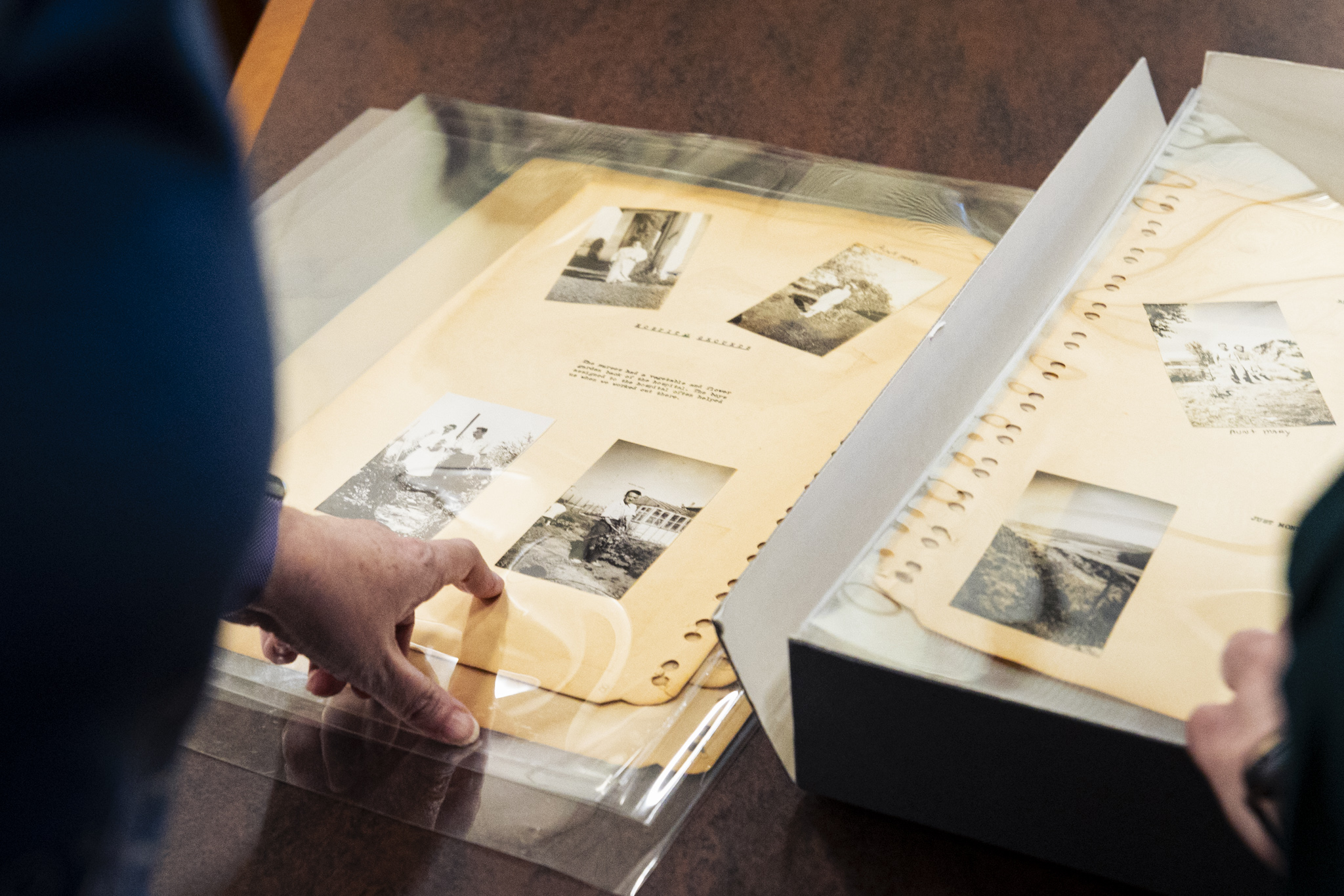 Pages of a scrapbook with black and white photos 