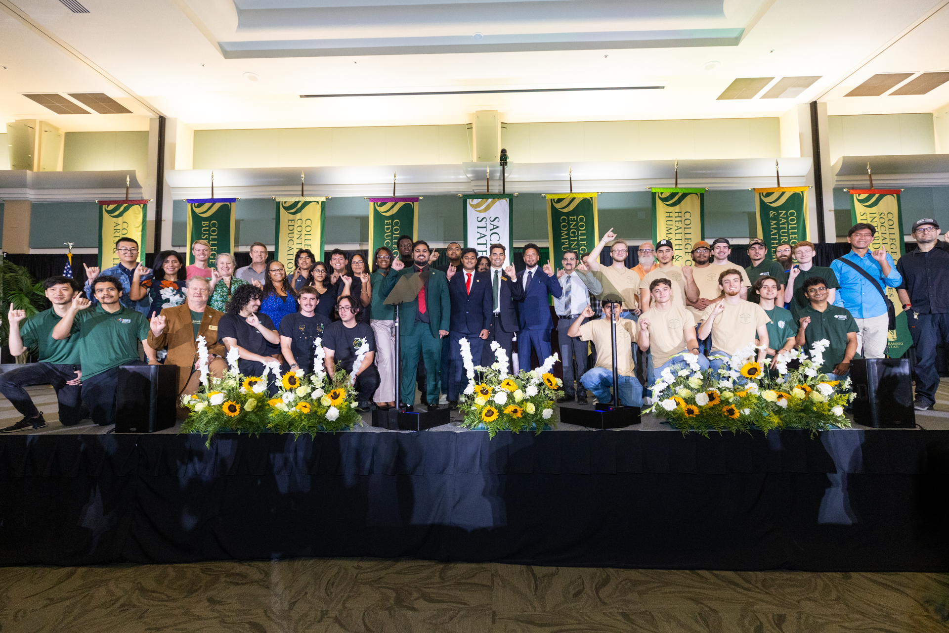 Members of the College of Engineering & Computer Science and President Wood pose on stage following the Fall Address.