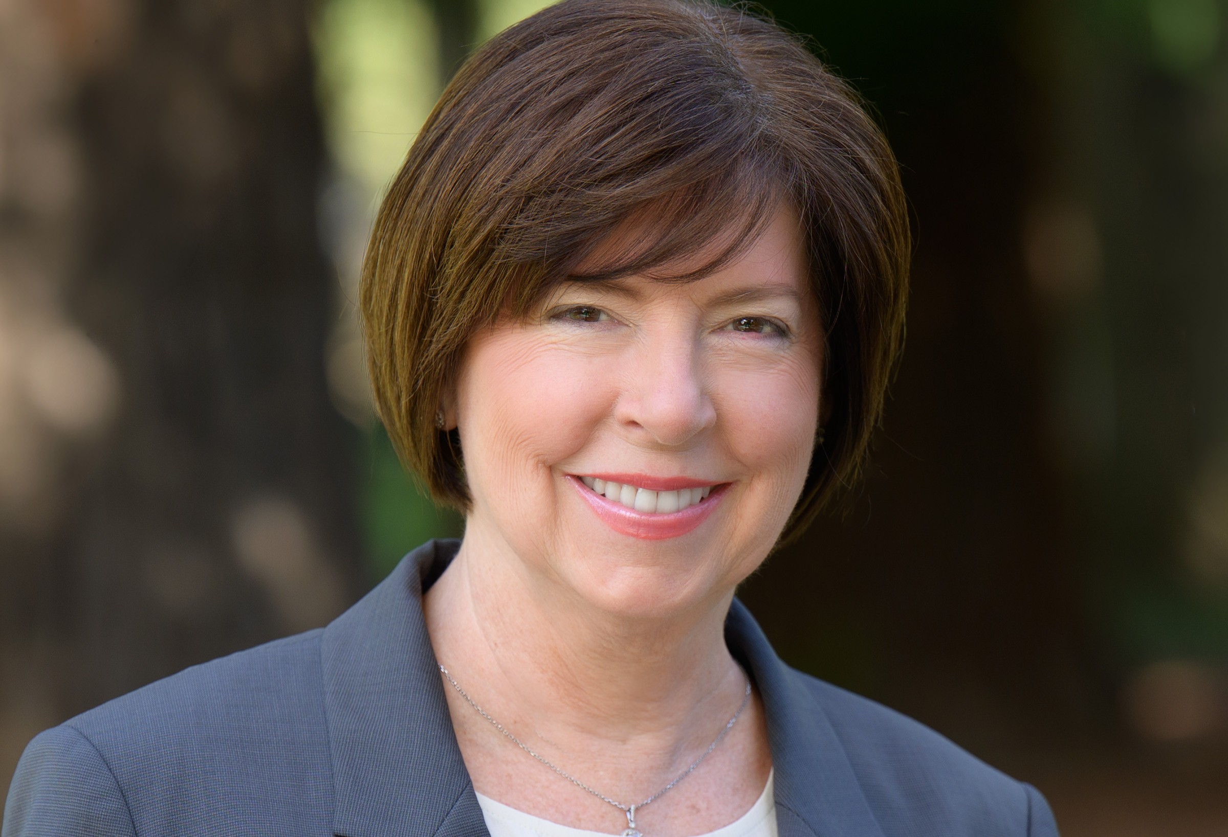 headshot of a woman with dark short hair
