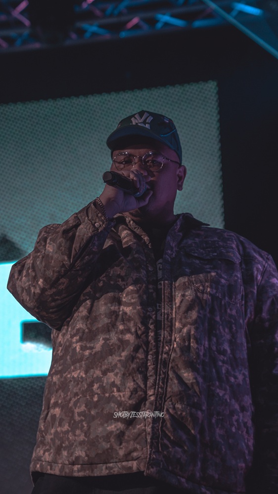 photo of darrell holding a microphone and singing