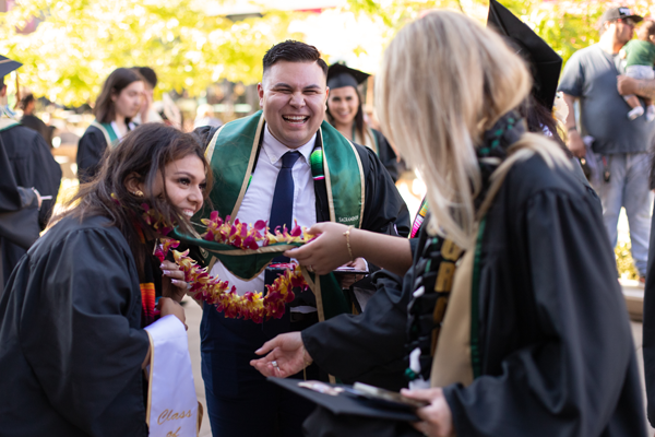 graduates smiling