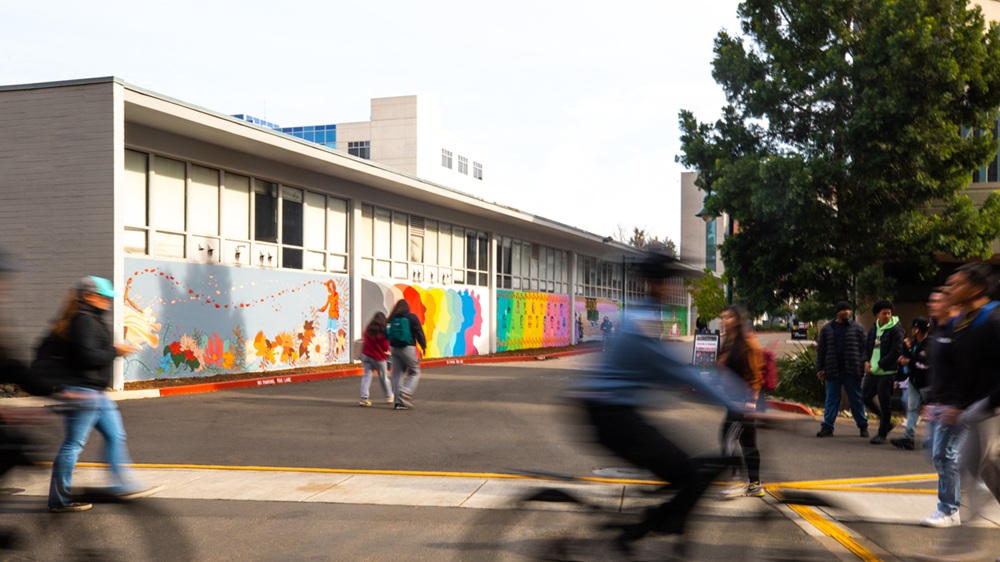 students walk through campus
