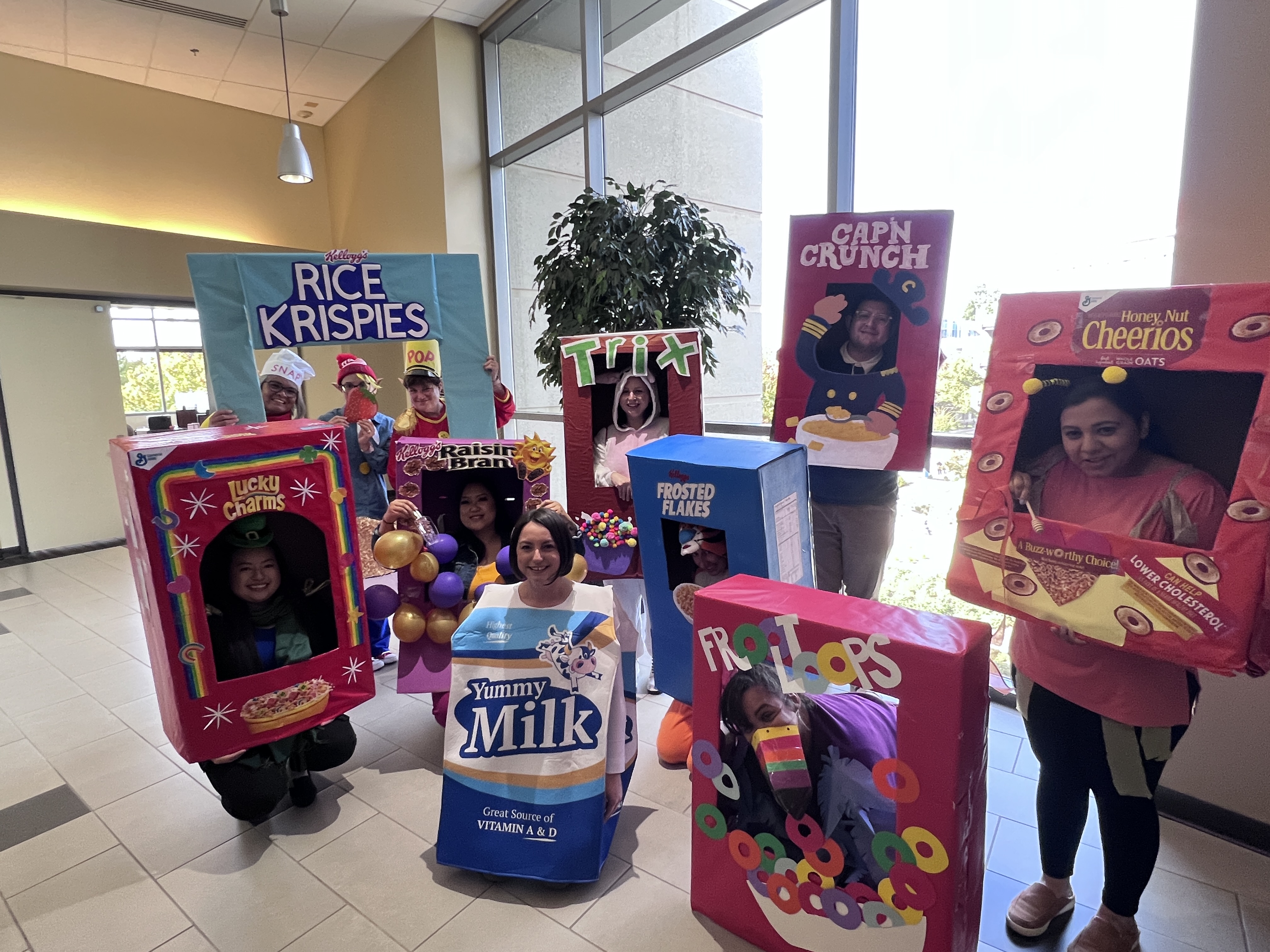 Sponsored Programs Administration – “Milk and Cereal” group dressed in costumes of cereal boxes and caron of milk inside building lobby area