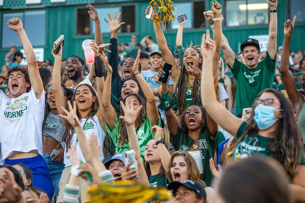 Group of Students Celebrating during a Sac State football game