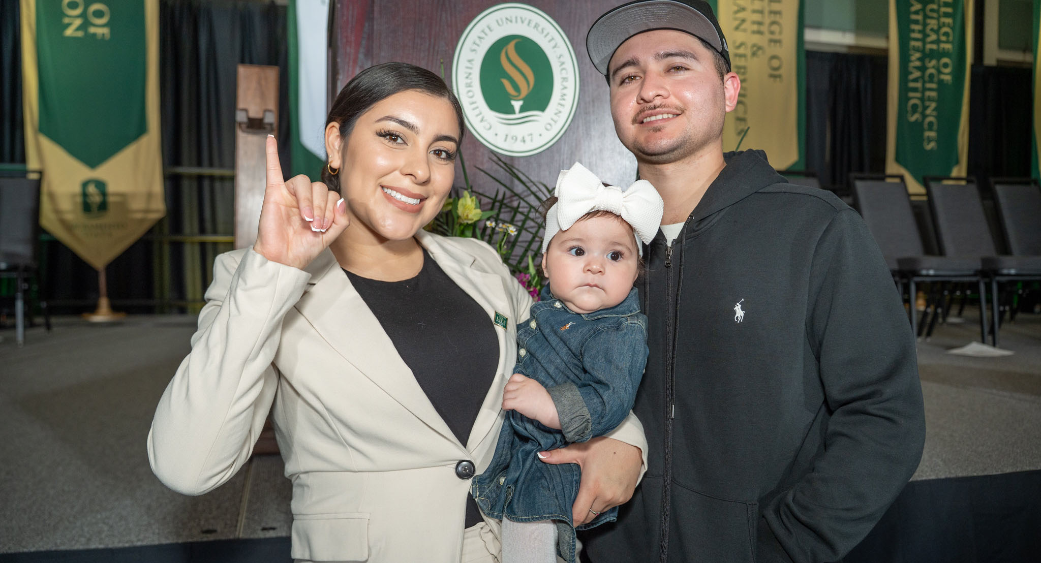 Young family with a kid hugging