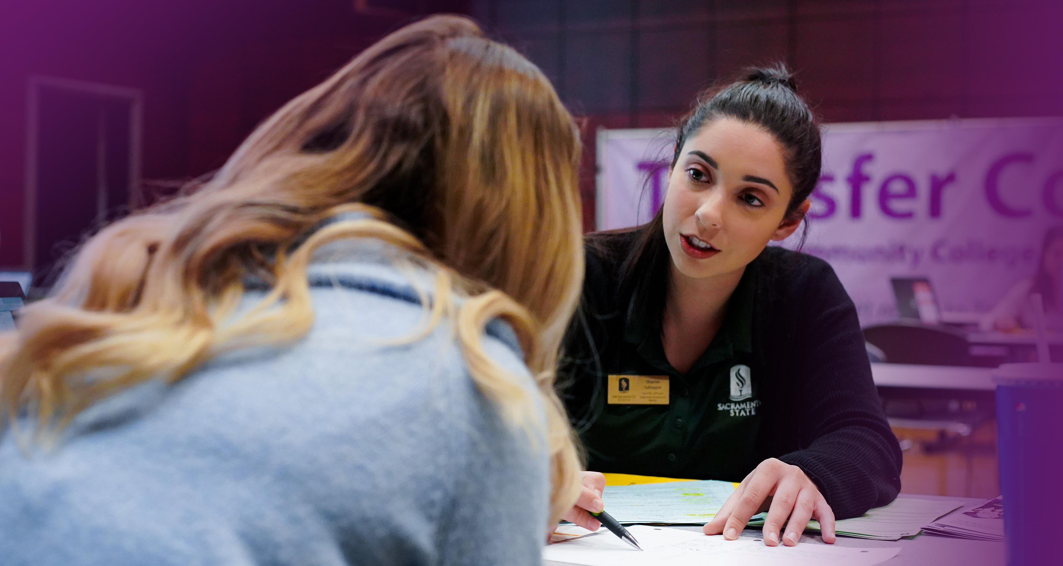 Woman working with a student on transfer credits