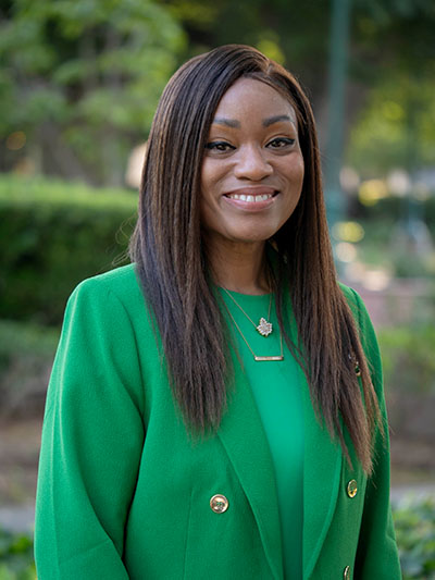 Photo of Aniesha Mitchell smiling at the camera