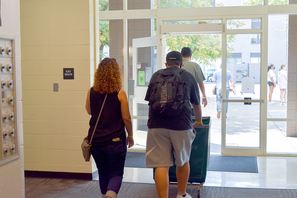 Student with his mother moving out of the dorms