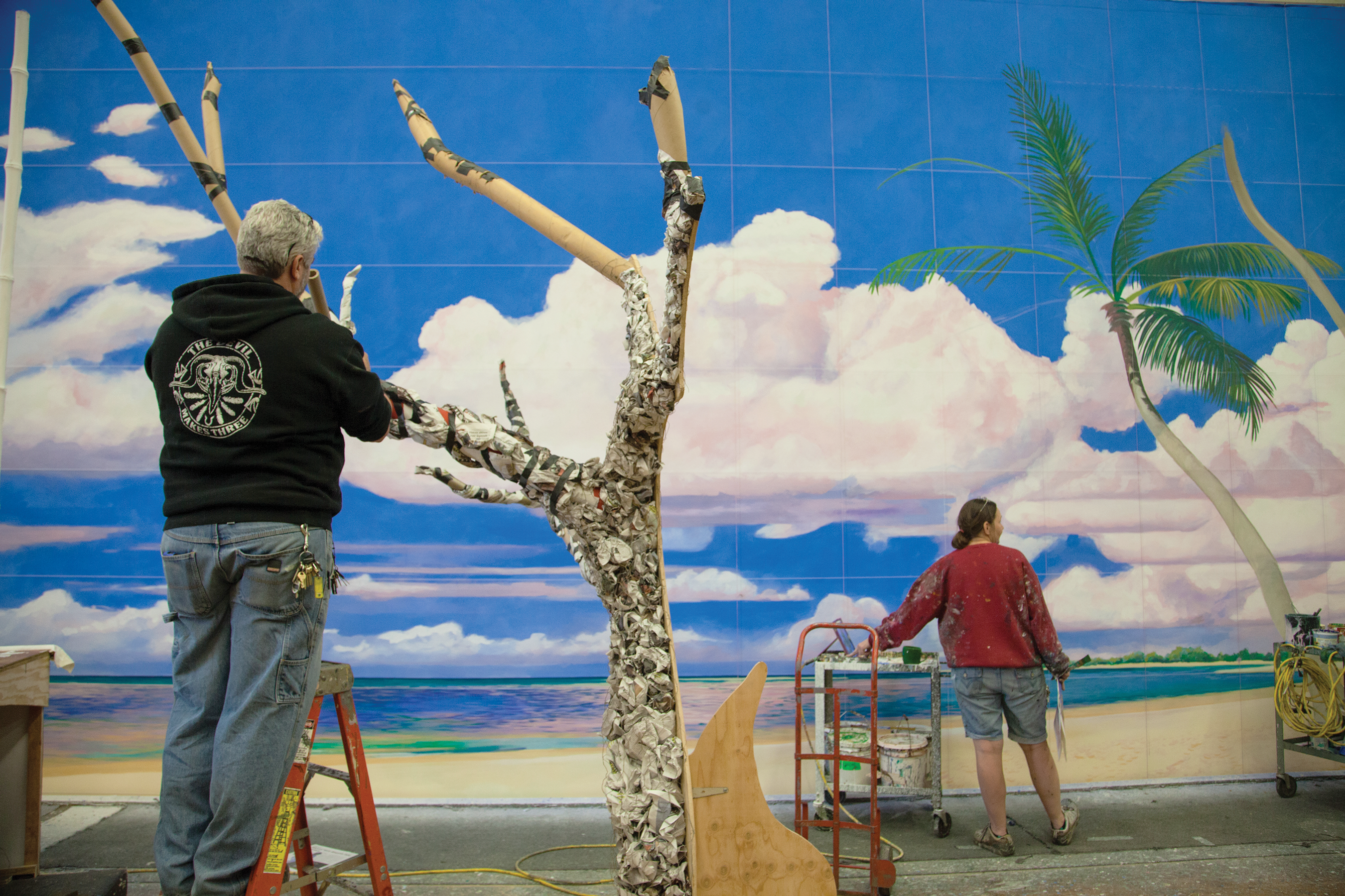 Photo of students working on set design for student showcase