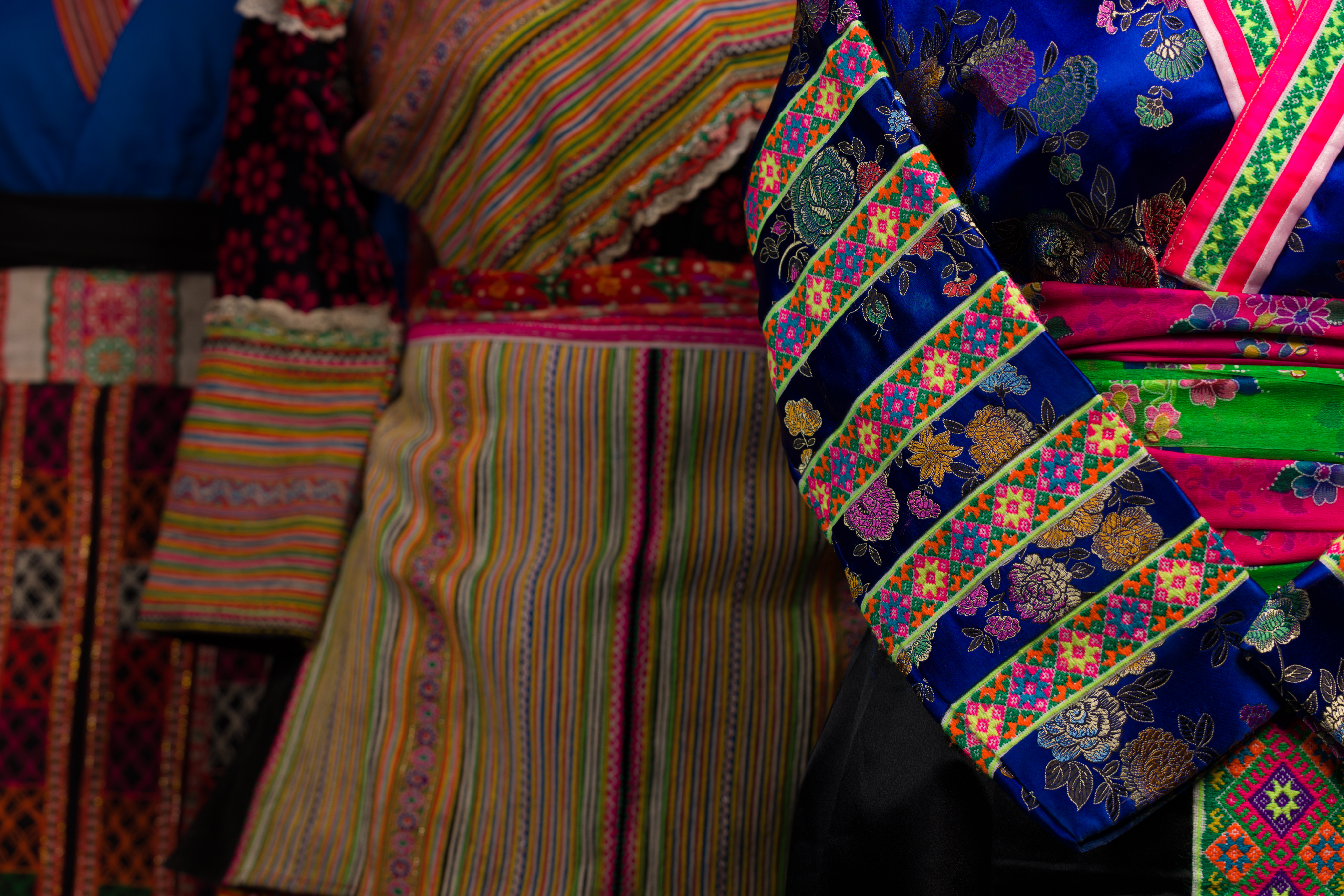 detail image of hmong gowns on mannequins for cloth as community exhibit