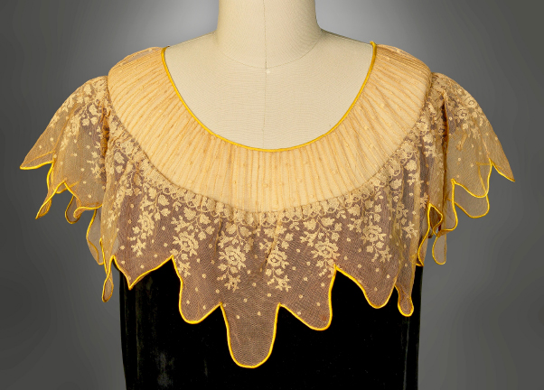detail of costume with lace collar